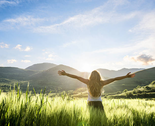 woman in nature with hands outstretched having a beautiful fresh morning woman in nature with hands outstretched having a beautiful fresh morning