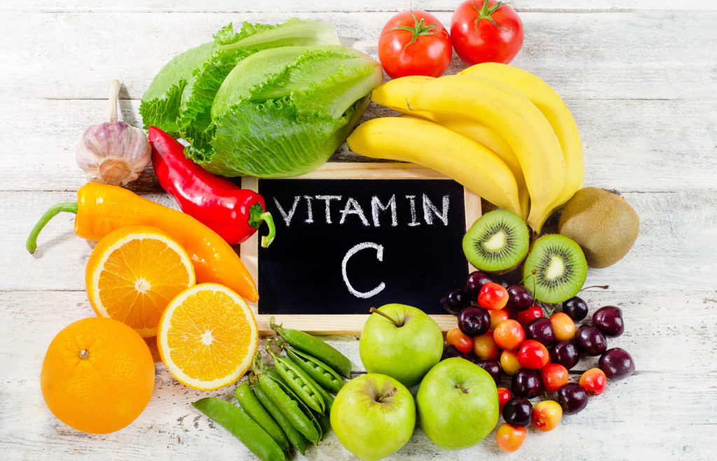 Foods High in vitamin C Foods High in vitamin C on a wooden board. Healthy eating. Flat lay